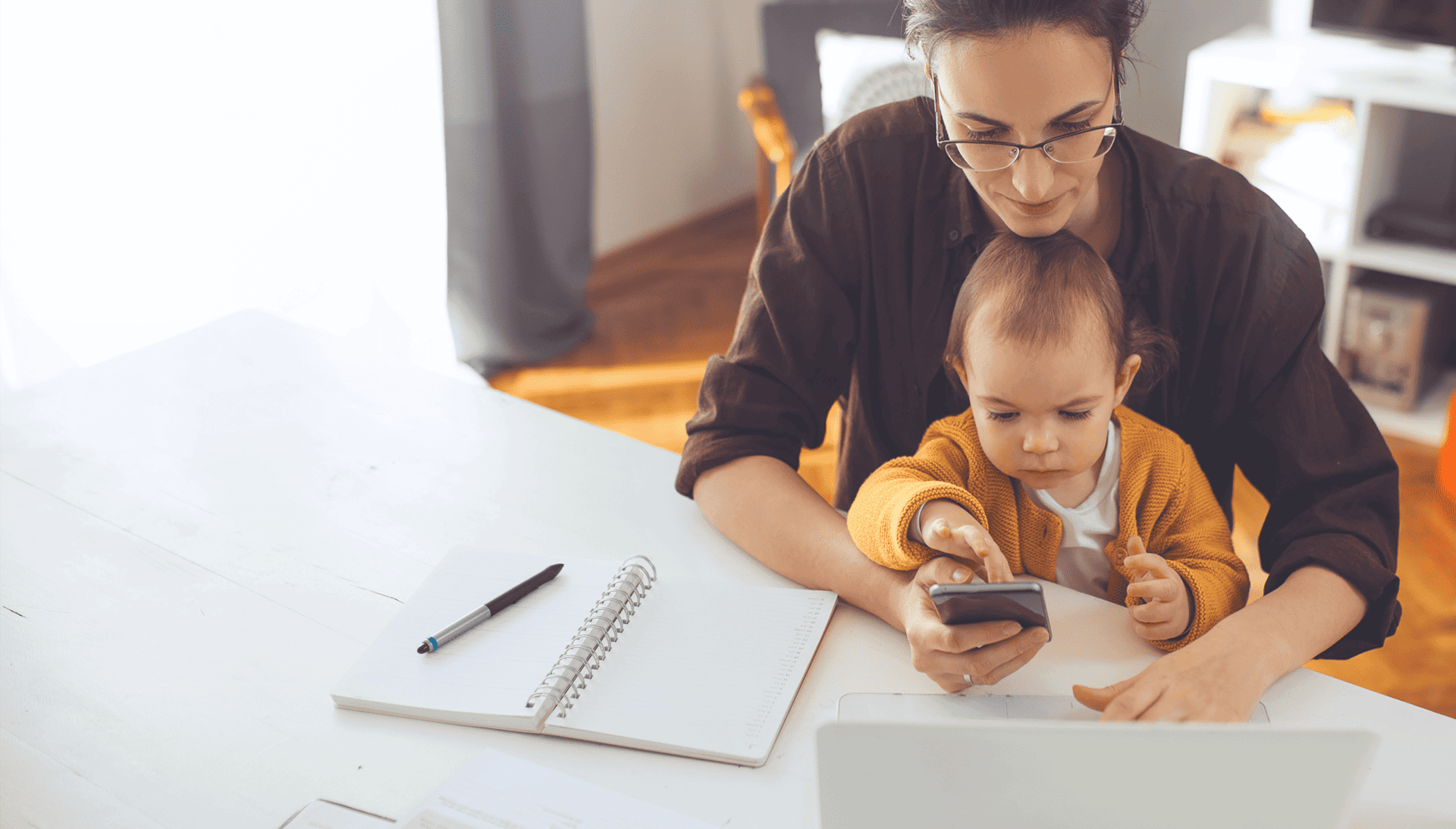 Mother with child looking at paperwork
