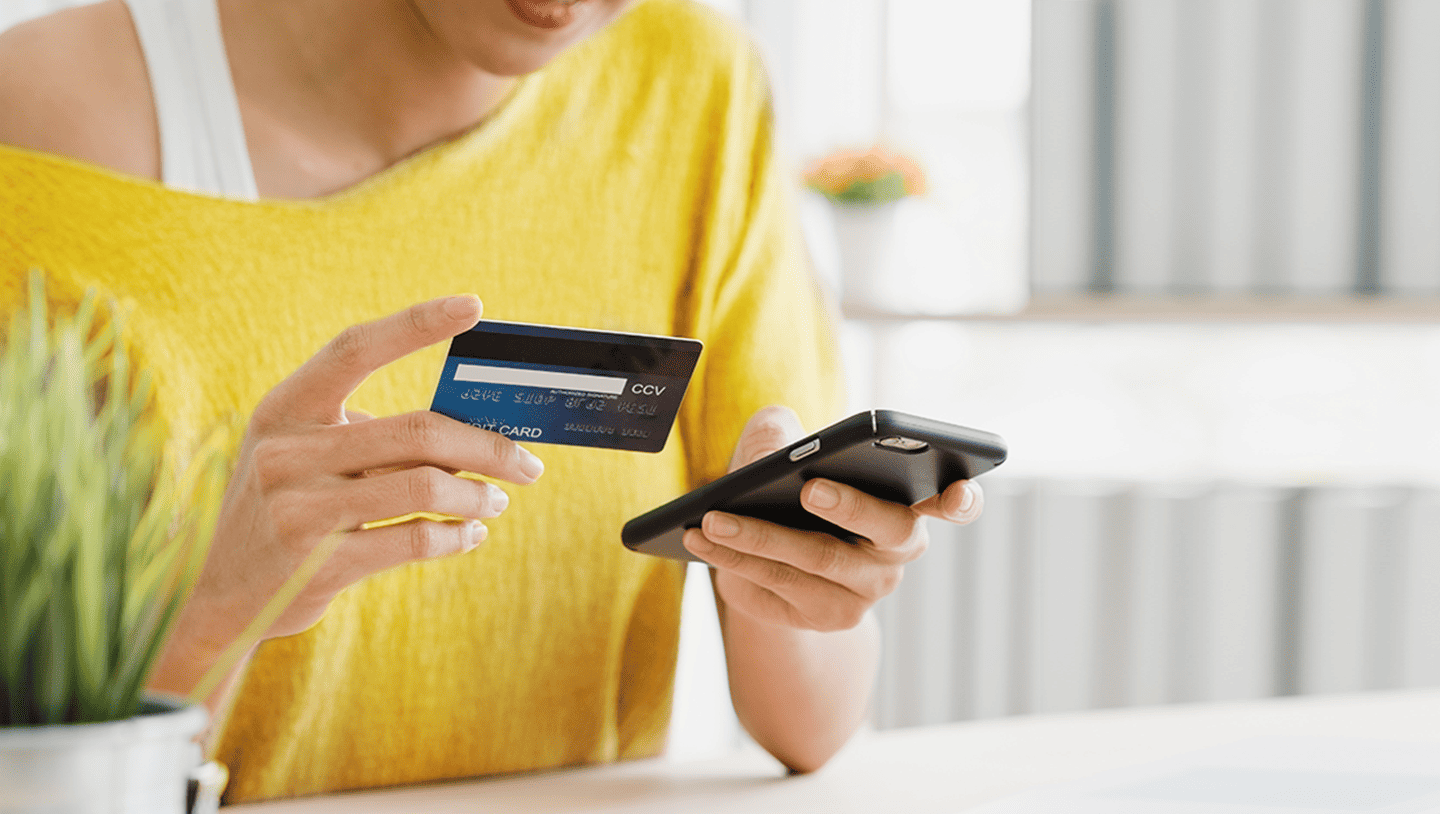 Woman paying by card in app
