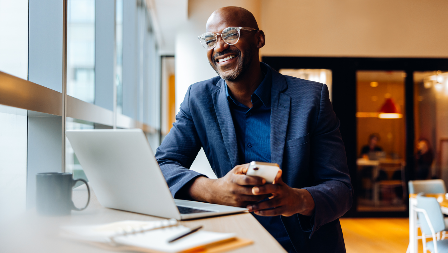 Smart reconciliation hero image for blog on the same topc – a man at a desk working.