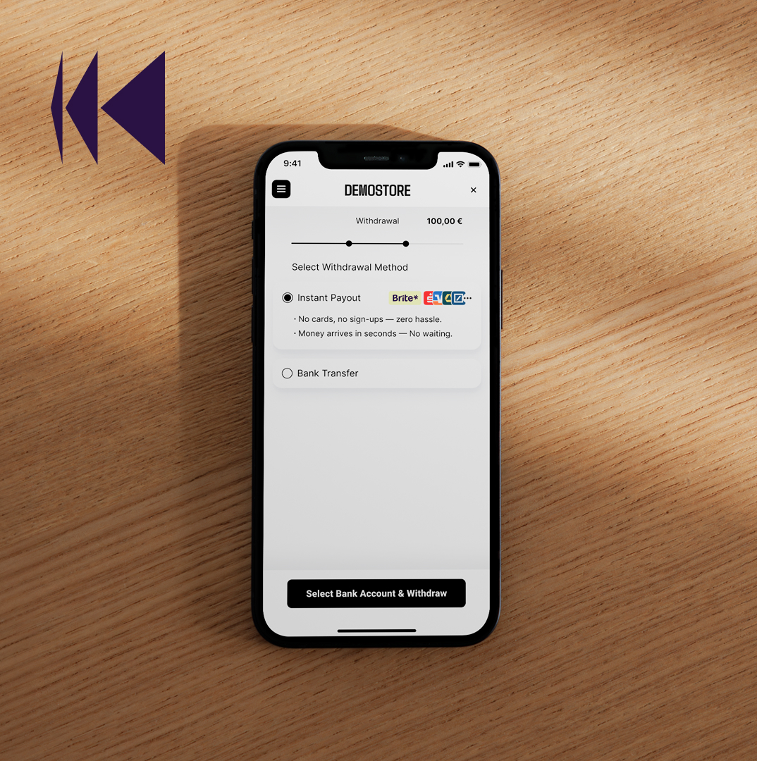 A mobile phone with Brite Instant Payouts sitting on a wooden table with the reverse payout symbol in the top left