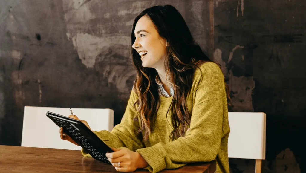 Young woman with tablet in desk