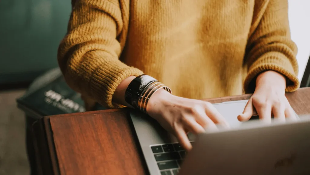 Person working on laptop in desktop