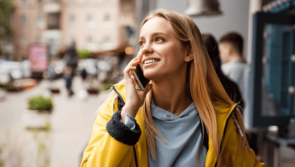 Woman talking on the phone in the street