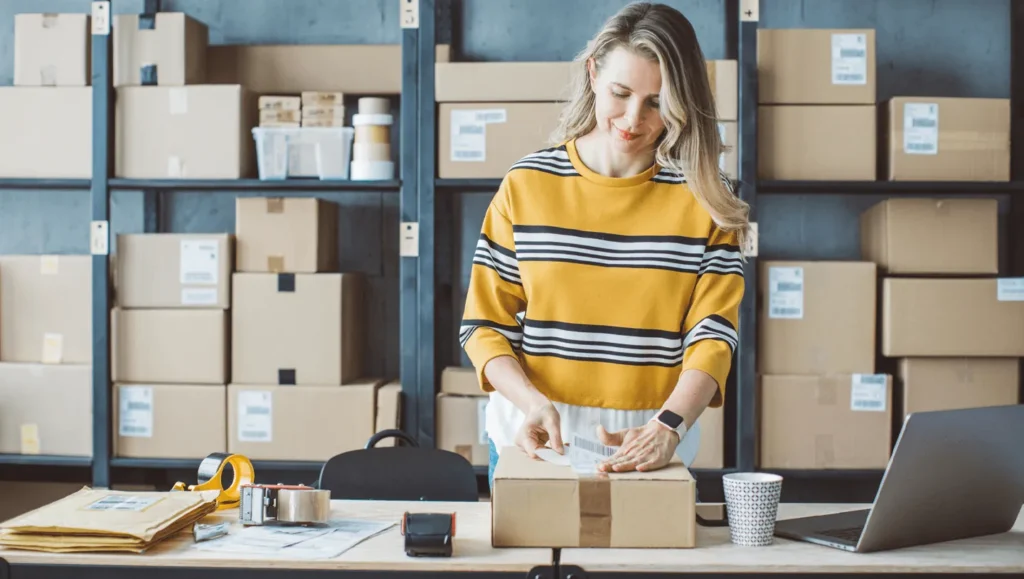 Woman preparing parcels to send