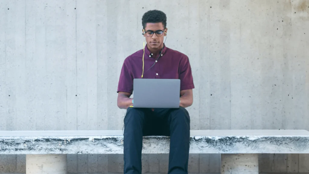 Man with laptop and headphones