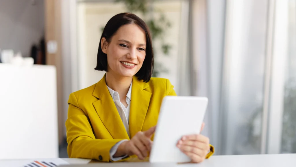 Woman in formal wear with a tablet