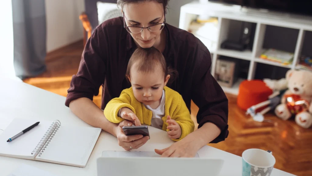 Woman working from home with a baby