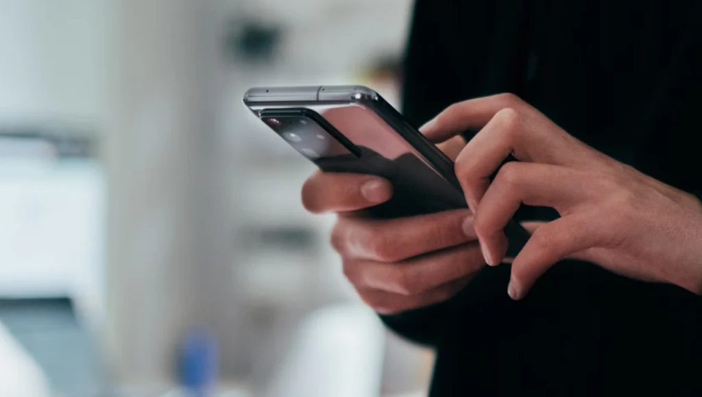 Consumer performing an instant payment transaction during mobile online shopping.